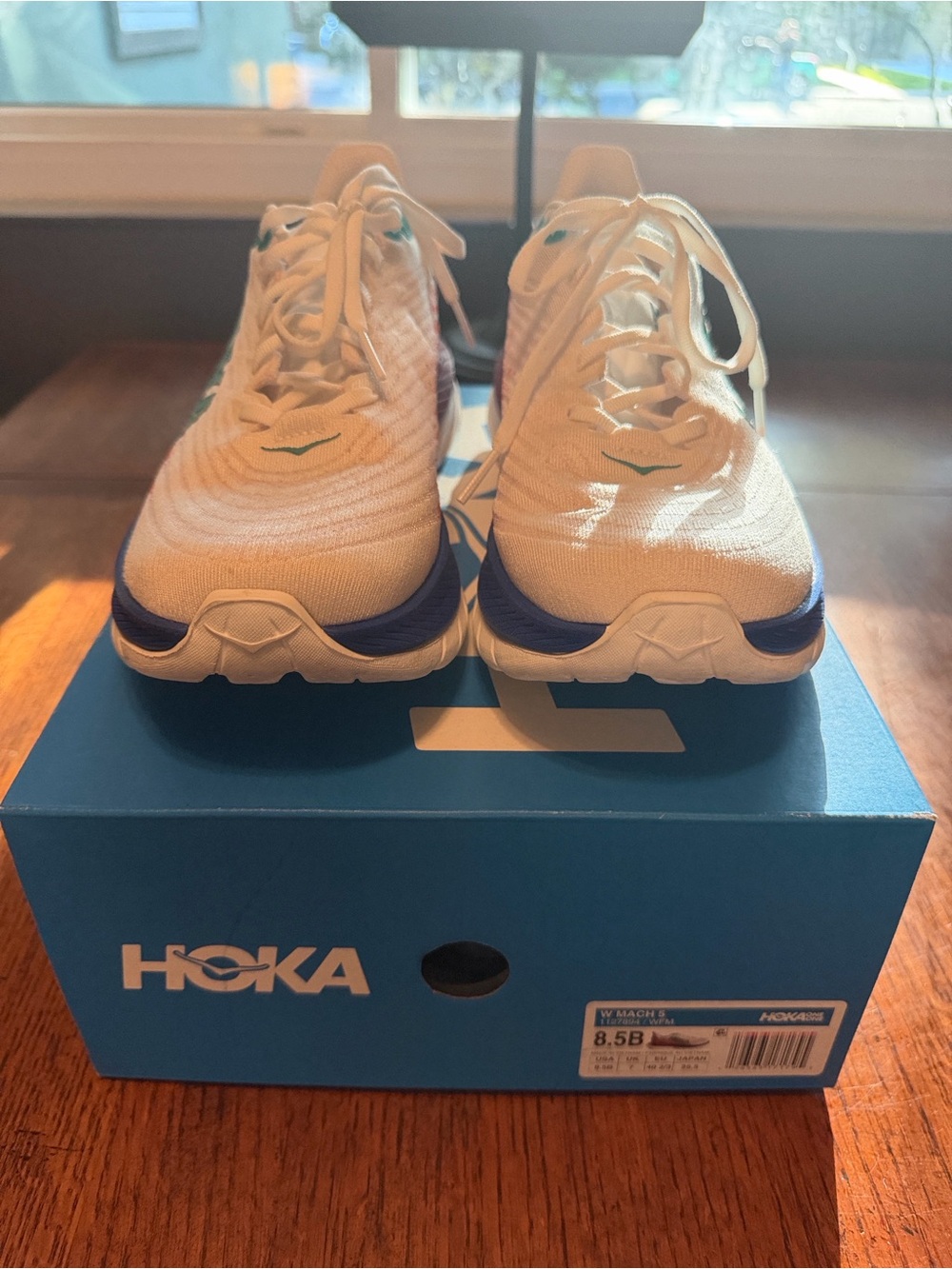 Hoka Mach 4 White Running Shoes with Blue and Teal Accents